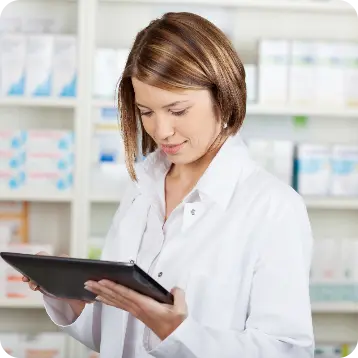 Photo of a pharmacist holding a tablet